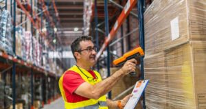 Engineer having an inspection of the warehouse racking system in the USA